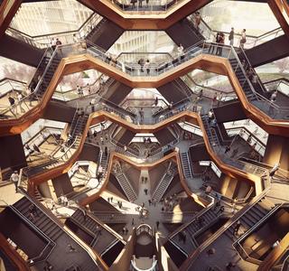 An image rendering of the inside of the Hudson Yards honey comb building with multiple stairways.