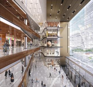A view of the Hudson Yards' atrium, a wooden and glass window space, full of shops & people.